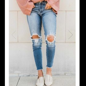 Medium wash distressed skinny crop jeans